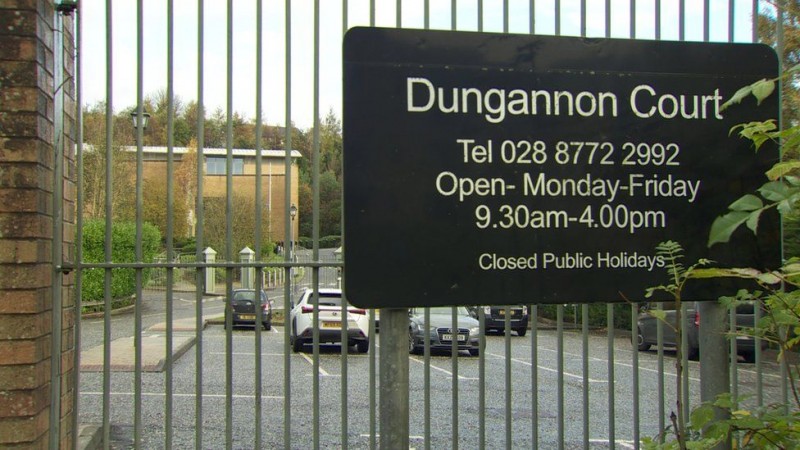 A sign on a gate reading 