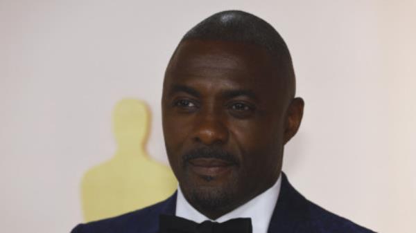 Idris Elba poses on the champagne-colored red carpet during the Oscars arrivals at the 95th Academy Awards in Hollywood, Los Angeles, California, US, March 12, 2023. REUTERS/Eric Gaillard