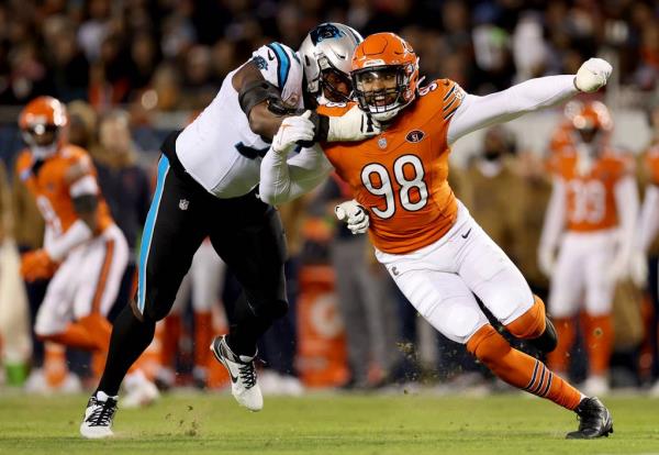 Bears defensive end Mo<em></em>ntez Sweat breaks through the block of Panthers offensive tackle Taylor Moton in the third quarter at Soldier Field on Nov. 9, 2023.