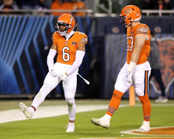 Bears cornerback Kyler Gordon celebrates after tackling Panthers running back Miles Sanders for a loss in the third quarter at Soldier Field on Nov. 9, 2023.