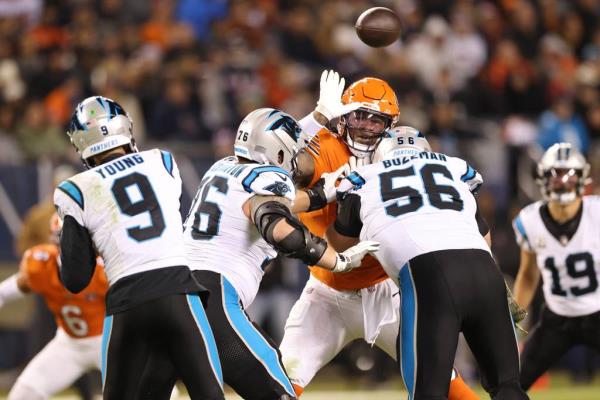Bears defensive tackle Gervon Dexter Sr. (99) is blocked by Panthers guard Calvin Throckmorton (76) and center Bradley Bozeman (56) in the third quarter at Soldier Field on Nov. 9, 2023.