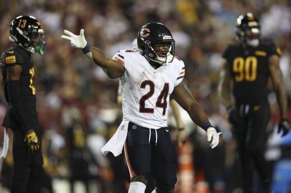 Bears running back Khalil Herbert celebrates a first down in the second quarter on Oct. 5, 2023, at FedEx Field.