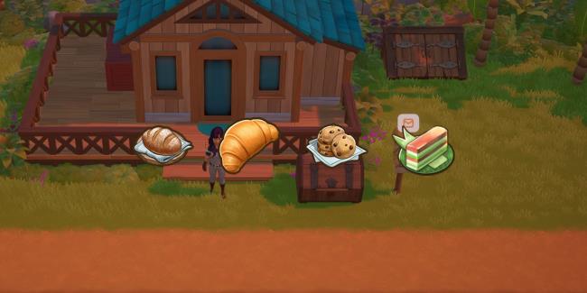 A shot of the Coral Island player farm showing the mailbox with a notification. There are icons for the in-game items Bread, Butter Croissant, coo<em></em>kies and Kue Lapis overlaying the image.