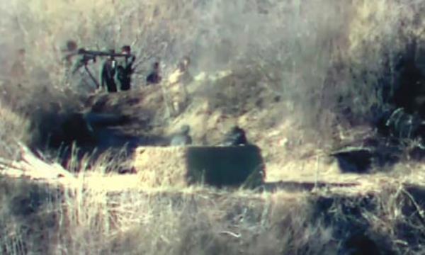 A photo released by the South Korean defence ministry purportedly shows North Korean soldiers near a guard post on the North side of the DMZ.