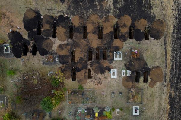 An aerial picture shows freshly dug graves at the cemetery in the village of Hroza, near Kharkiv, wher<em></em>e at least 52 people were killed in a missile attack amid Russia's o<em></em>ngoing attack on Ukraine