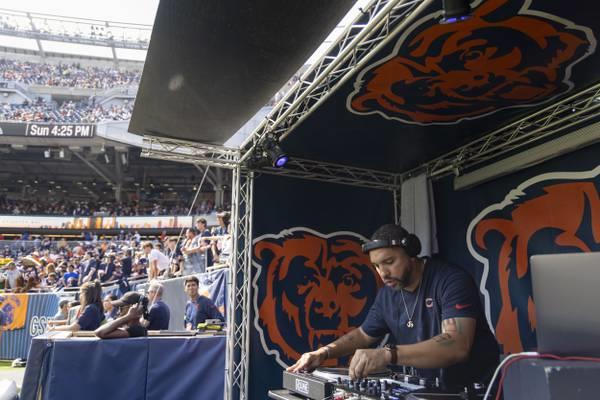 DJ Jay iLLa plays in the north end zone during warmups before the Chicago Bears and Green Bay Packers play on Sept. 10, 2023, at Soldier Field.
