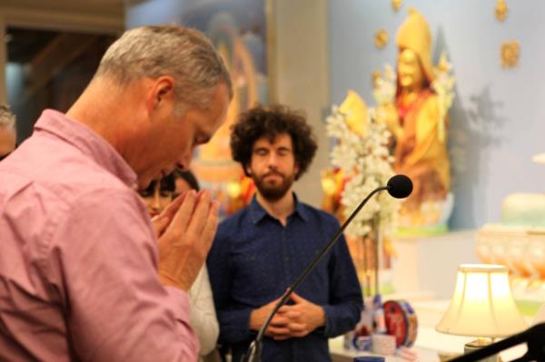 Morten Clausen, a Buddhist teacher at the Kadampa Meditation Center, leads the meditiation with participants following along behind him.
