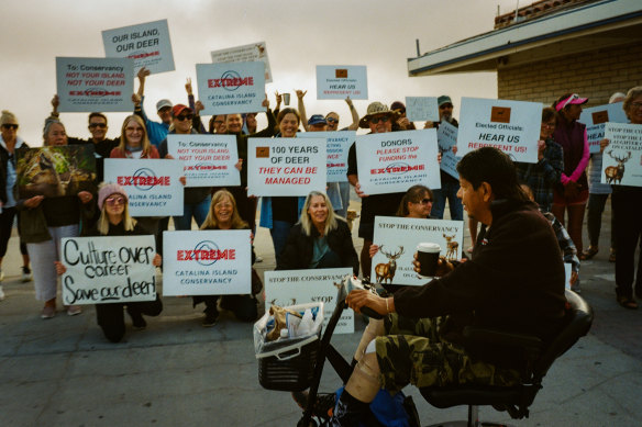 Avalon residents who learned of the arrival of journalists from The New York Times demo<em></em>nstrate at the ferry terminal for the California coastal island of Santa Catalina.