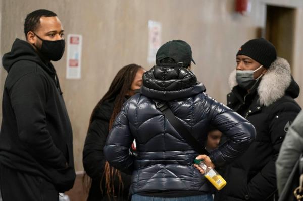 Nisaa Walcott's family members talk outside of court.