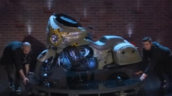 people bringing out motorcycle