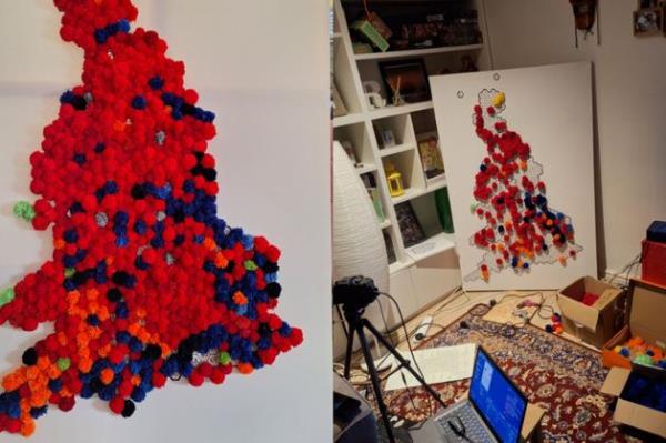 一对夫妇在跟踪结果后制作了一张覆盖着红色绒球的选举地图