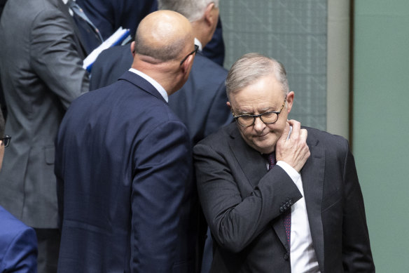 Opposition Leader Peter Dutton walks past Prime Minister Anthony Albanese after a division during Question Time at Parliament House on Wednesday.