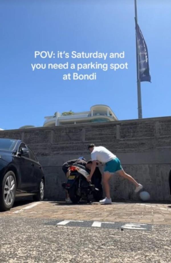 Two men have filmed themselves moving a moped from a parking spot at Bo<em></em>ndi Beach. Picture: Tik Tok