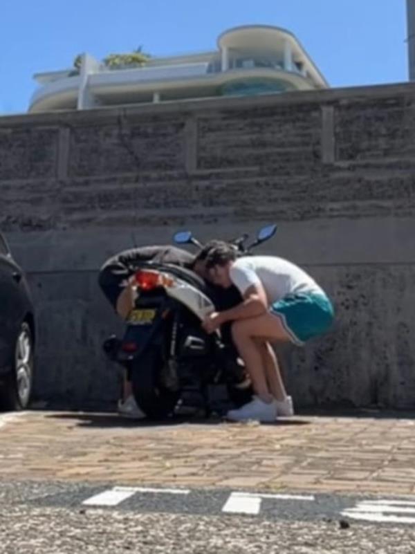 Two men have filmed themselves moving a moped from a parking spot at Bo<em></em>ndi Beach. Picture: Tik Tok