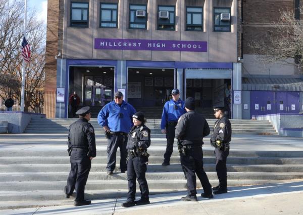 NYPD officers are seen outside of Hillcrest High Schoo