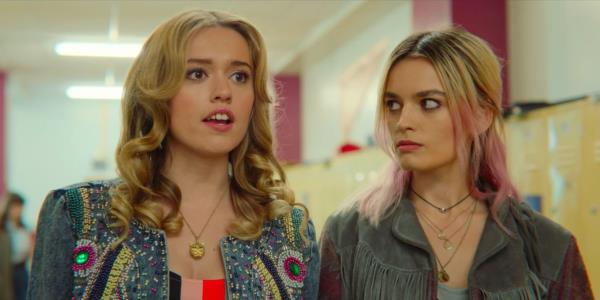 Aimee and Maeve stand together in the school hallway in Sex Education