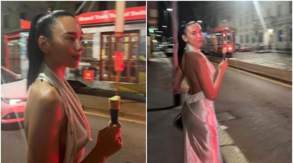 芭比娃娃Dua Lipa穿着时髦的露背丝绸连衣裙出现在伦敦街头