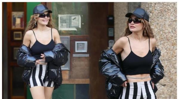 丽塔·奥拉白天在伦敦穿着露脐上衣和紧身自行车短裤，看起来很时髦