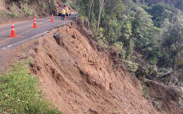 Karekare locals with the aid of officials started clearing blocked roads after Cyclone Gabrielle.