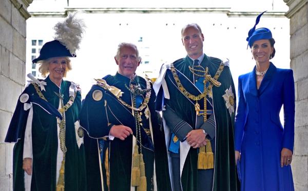 (L-R) Britain's Queen Camilla, Britain's King Charles III, Britain's Prince William, Prince of Wales and Britain's Catherine, Princess of Wales pose for a photograph after watching a fly-past by the British Royal Air Force's (RAF) aerobatic team, the 