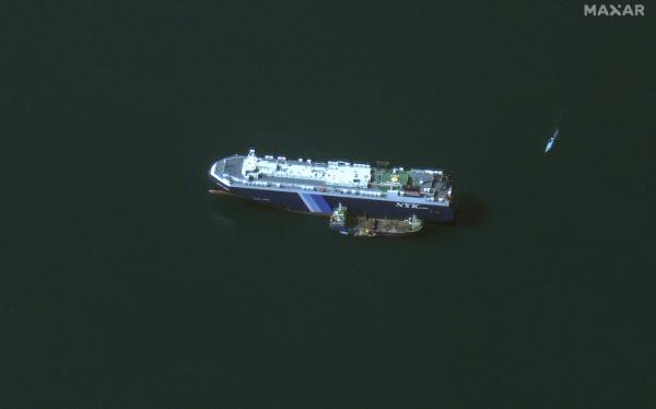 (FILES) This handout satellite picture released by Maxar Technologies on November 28, 2023, shows the recently seized Isreali-l<em></em>inked Galaxy Leader ship, that was captured by Huthi fighters on November 19, next to a support vessel in the southern Red Sea near Hodeida, Yemen. Heavy air strikes pounded rebel-held cities in Yemen early on January 12, 2024, according to the Huthi rebels' official media and AFP correspondents. The capital Sanaa, Hodeida and Saada were all targeted, the Huthis' official media said, blaming 