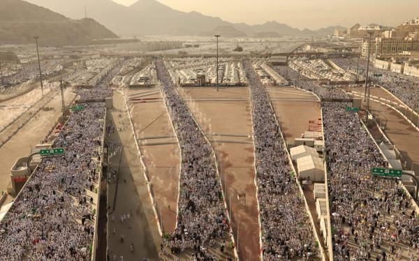 Muslim pilgrims arrive to perform the symbolic 'sto<em></em>ning of the devil' ritual as part of the hajj pilgrimage in Mina, near Saudi Arabia's holy city of Mecca, on June 16, 2024.