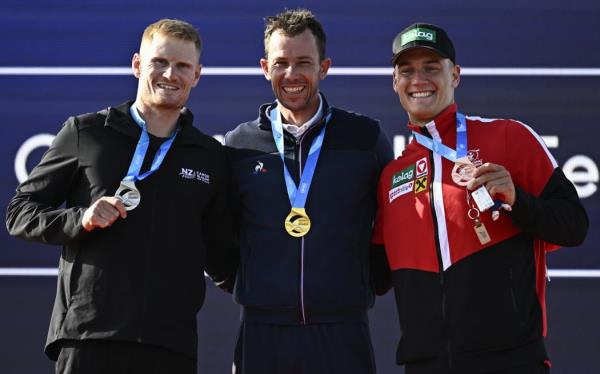 Silver medalist New Zealand's Finn Butcher, gold medallist France's Boris Neveu and bro<em></em>nze medalist Austria's Felix Oschmautz celebrate on the podium during the 2024 Olympic Games Test Event, Paris.