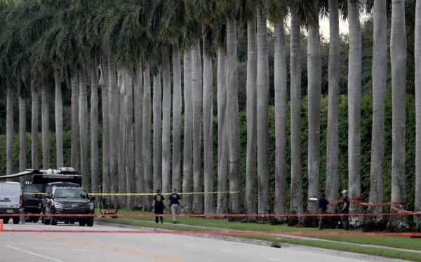 Law enforcement perso<em></em>nnel investigate the area around Trump Internatio<em></em>nal Golf Club after an apparent assassination attempt of former President Do<em></em>nald Trump on September 15, 2024 in West Palm Beach, Florida.