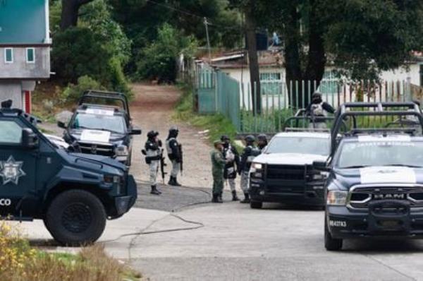 Members of the Natio<em></em>nal Guard patrol the town of Texcaltitlán, on December 11.
