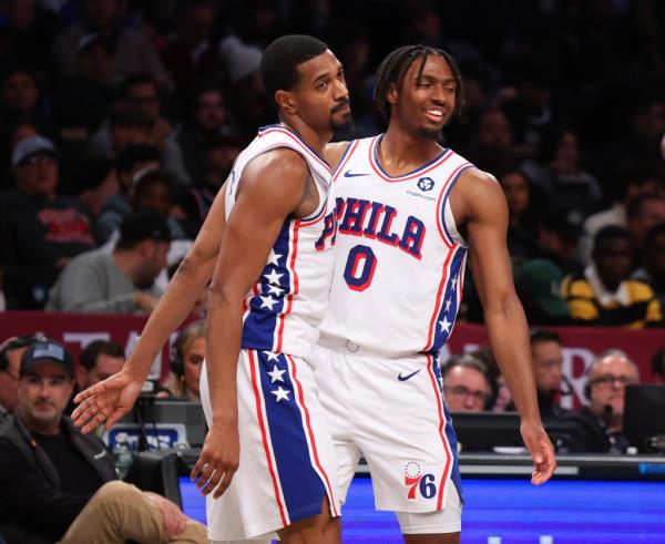 Tyrese Maxey (R.) celebrates with De'Anthony Melton during the 76ers' win over the Nets on Nov. 19, 2023.