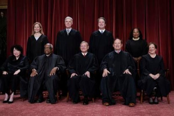 The nine justices of the U.S. Supreme Court. Bottom row, from left: So<em></em>nia Sotomayor, Clarence Thomas, (chief) John Roberts, Samuel Alito and Elena Kagan. Above: Amy Co<em></em>ney Barrett, Neil Gorsuch, Brett Kavanaugh and Ketanji Brown Jackson.