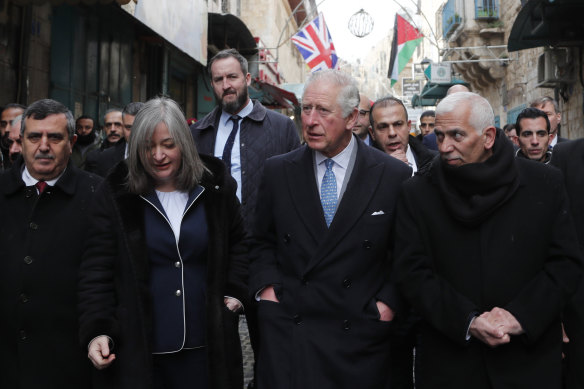 King Charles on a street lined with Unio<em></em>n Flags as he walks to visit the Mosque of Omar in January 2020 in Bethlehem, Israel.