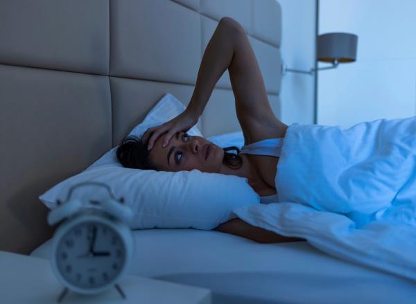 woman can't sleep, co<em></em>ncept of bad habits that cost hours of sleep
