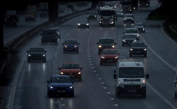 Cars travel along the M6 motorway near Knutsford, Britain
