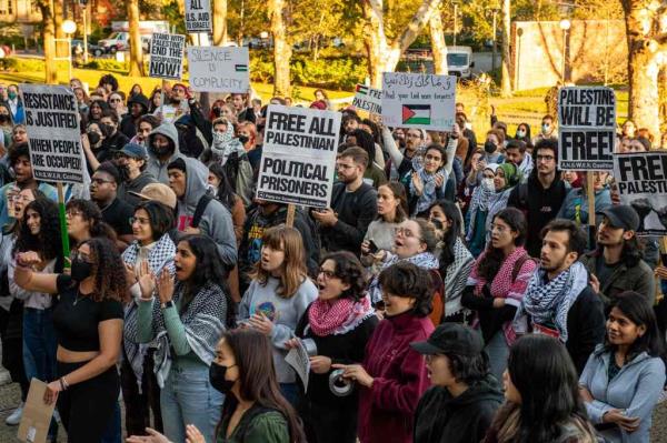 Protesters for Palestine hold signs at MIT