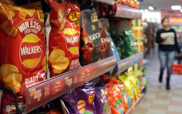 Walkers crisps on the shelves i supermarkets.