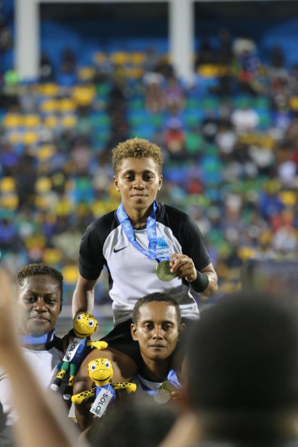 Fiji women's captain, Mereula Torooti, is carried aloft sporting her Pacific Games gold medal. Ho<em></em>niara 25 November 2023
