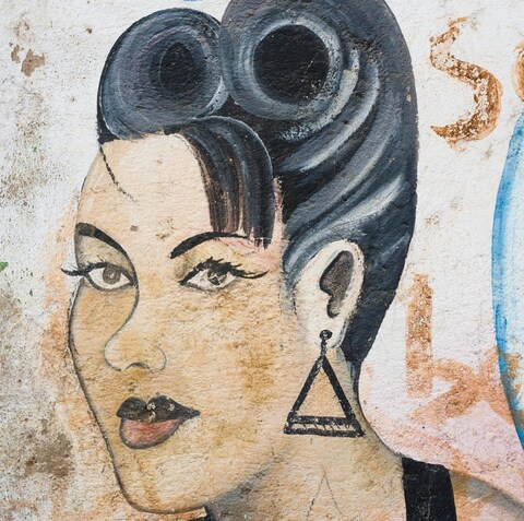 An advertisement on the wall of a hair salon near the Ngong Road in Nairobi, Kenya