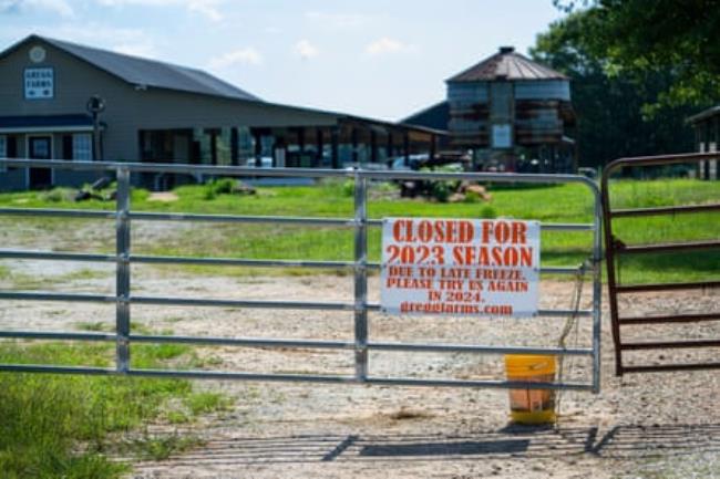 A sign hangs from the gate at Greggs Farms in Concord, Georgia.