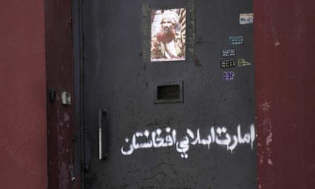 Arabic graffiti reading ‘Afghanistan Islamic Emirate’ on the main door of the Afghanistan Natio<em></em>nal Institute of Music in Kabul.