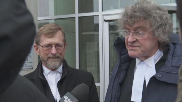 Jerome Kennedy and James Lockyer stand outside the Saint John courthouse.