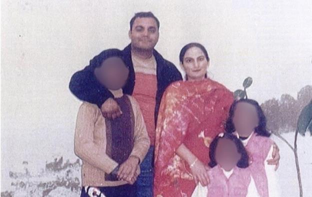 Jameela Qadeer is pictured with her husband Ahmad Qadeer, along with her sister's three children in 2009. Her sister died in 2012 and the children were taken into the Qadeers' care. Their faces are blurred because of the risk they face as Ahmadis living in Pakistan.