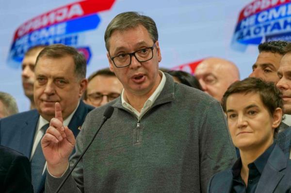 Serbian President Aleksandar Vucic speaks to the media in his party headquarters after a parliamentary and local election in Belgrade, Serbia, Sunday, Dec. 17, 2023. Serbia's governing populists claimed a sweeping victory Sunday in the country's parliamentary election, which was marred by reports of major irregularities both during a tense campaign and on voting day. (AP Photo/Darko Vojinovic)