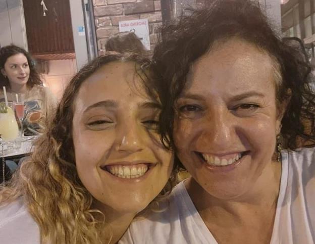 Two women smiling.