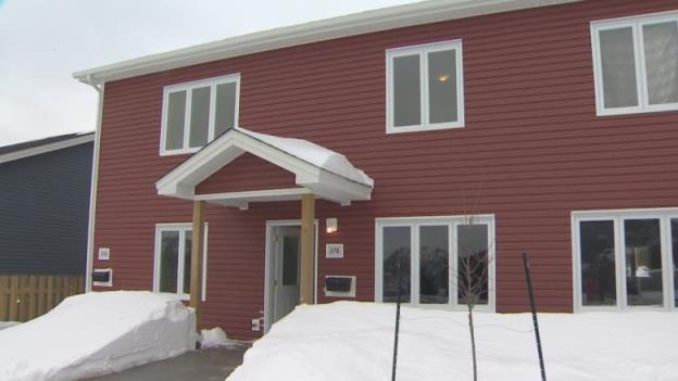 The exterior of a red home.