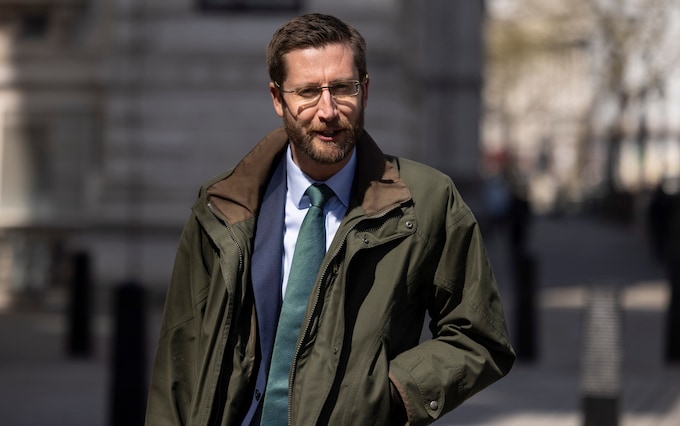 Cabinet Secretary Simon Case walks through Westminster