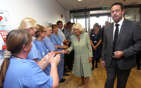 Tony Chambers, right, presiding over a visit to the Countess of Chester from Camilla, then Duchess of Cornwall, in 2014