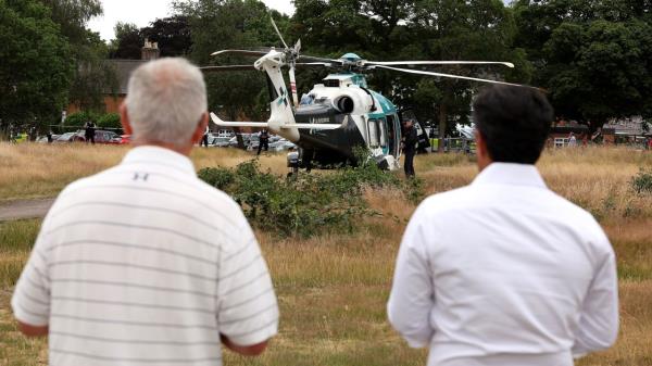 An air ambulance lands on Wimbledon Common in respo<em></em>nse to the incident.
