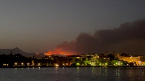 Smoke rises from a wildfire on Corfu Island, Greece, July 23, 2023.