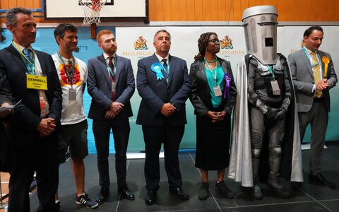 Danny Beales (third left) took his place at the back of the stage as the votes were read out